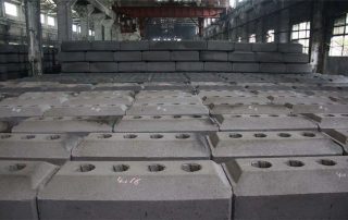 Prebaked anode carbon blocks are in final products warehouse