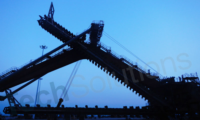 Twin booms portal scraper reclaimer is being commissioned at night with blue sky Two Scraper Booms Portal Scraper Reclaimer